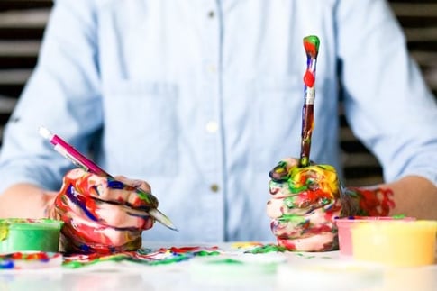 hands covered with paint